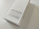 a white box sitting on a table with a white table cloth