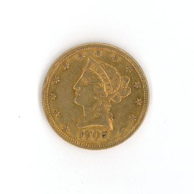une image d'une pièce d'or sur une surface blanche