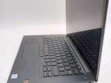 a laptop computer sitting on top of a white table