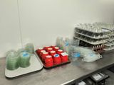 many trays of food on the counter in the kitchen
