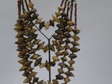 a long necklace with a bunch of beads hanging from it
