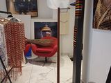an image of a clothing store with a picture of a woman on the wall
