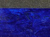 a blue and black painting on the wall next to a fire hydrant