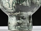 a black and white picture of a vase on a table