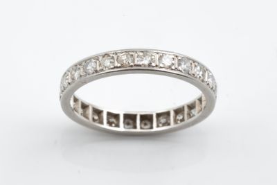 a close up of a diamond ring on a white background