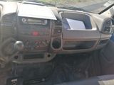 a dashboard of a car with a radio and a steering wheel