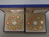 two boxes with different coins in them sitting on a table