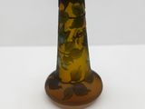 a glass vase with a design on it sitting on a table