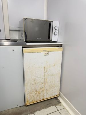 a microwave and a dishwasher in a small kitchen