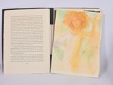 an open book with a picture of a woman on it