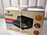 packaging of a home air fryer sitting on top of a white table