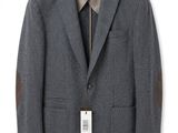 a picture of a gray jacket with a tag on it