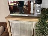 a microwave that is on top of a table