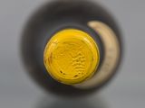 a close up of a bottle of wine on a table