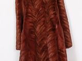 a woman ' s brown fur coat on a mannequin mannequin mannequin mannequin mannequin mannequin mannequin manne