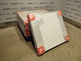 a stack of mattresses sitting on a pallet in a warehouse