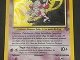 a close up of a pokemon card on a table