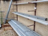 a row of empty metal shelves on the side of a building