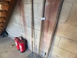 a pile of tools that are next to a wall
