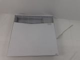a white air conditioner sitting on a white sheet