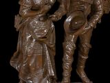 a statue of a man and a woman standing next to each other