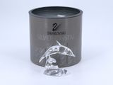 swarovski silver crystal candle in a tin with a dolphin figurine