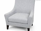 La chaise grise est posée sur un fond blanc, avec un fond blanc