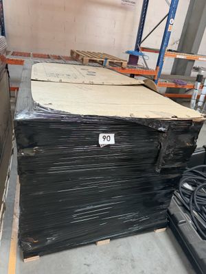 a large stack of boxes in a warehouse with a price tag on it