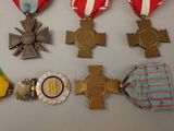 many medals that are on display on a table