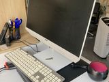 a computer on a desk with a keyboard and mouse