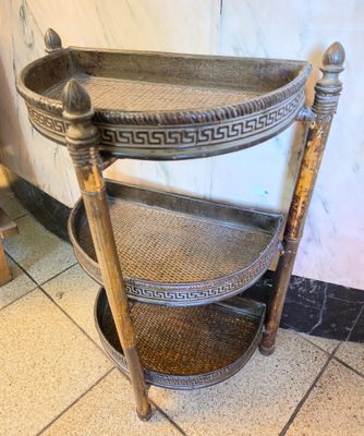 a wooden shelf that has a basket on top of it
