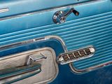 a close up of a door handle on a blue car