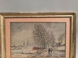 two framed pictures of a winter scene with a man and a dog