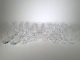 a lot of glasses that are sitting on a table