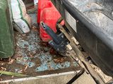 an image of a dump truck with a wheelbarrowr in the back