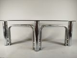 pair of chromed steel and glass coffee tables