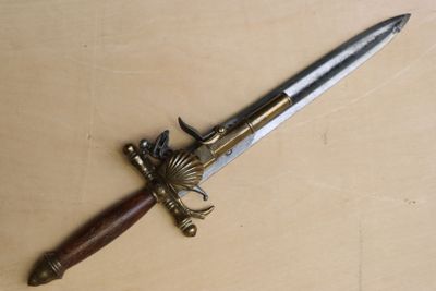 a knife that is laying on a table