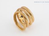 an image of a gold snake ring with diamonds on it