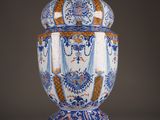 a blue and white vase sitting on a table