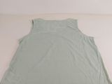 an image of a green tank top laying on a white surface