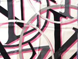 an image of a pink and black scarf on a table