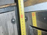 a measuring tape that is on the side of an oven