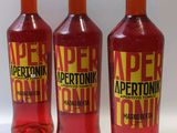 trois bouteilles d'Apertonik Cran posées sur une surface blanche