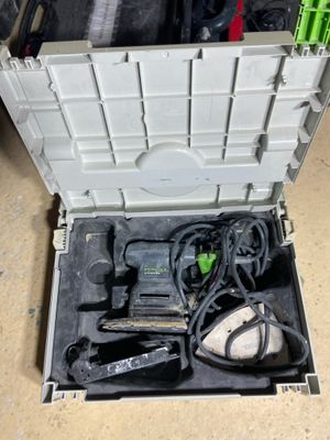 a tool box with tools inside of it on the floor