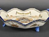 an image of a blue and white bowl sitting on top of a table