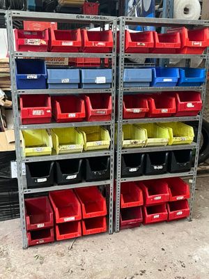many bins of different colors and sizes on the shelves