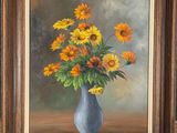 painting of sunflowers in a blue vase on a table