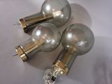 three light bulbs that are on a white surface