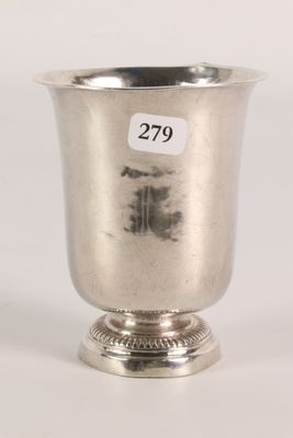 an antique silver cup with a number on the side of it