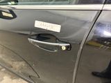 a car door handle with a sticker on it